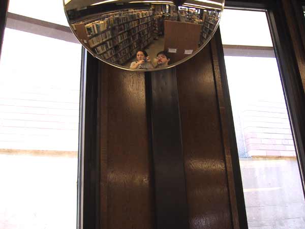 [We took a shot of ourselves in the mirror, it's the only one of both of us from this trip.
]