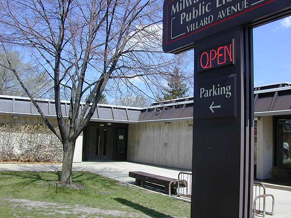 [<a href=http://www.mpl.org/files/branch/villard.htm>Villard Branch</a>. This was the sort of sign that greeted you at most of the libraries. Brown, with a motel-style OPEN neon light. Without exception, all of these libraries had great parking and easy to understand signs.
]